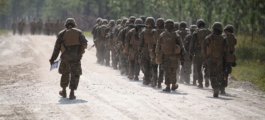 Soldiers walking on Camp Lejeune road.