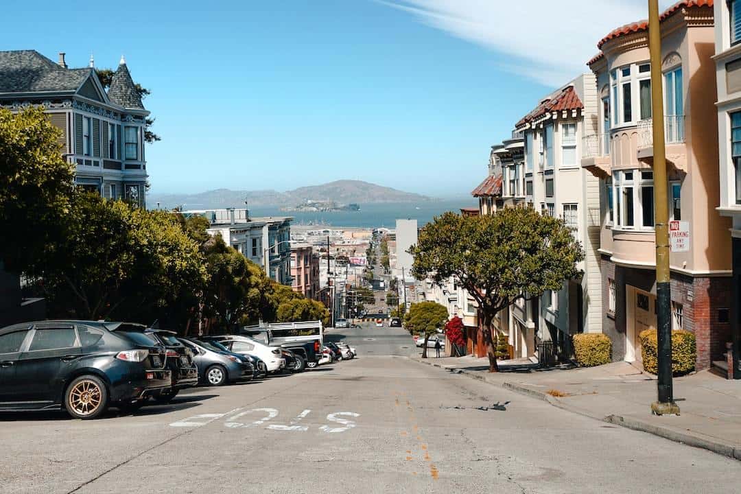 A street in san francisco with cars parked on it.